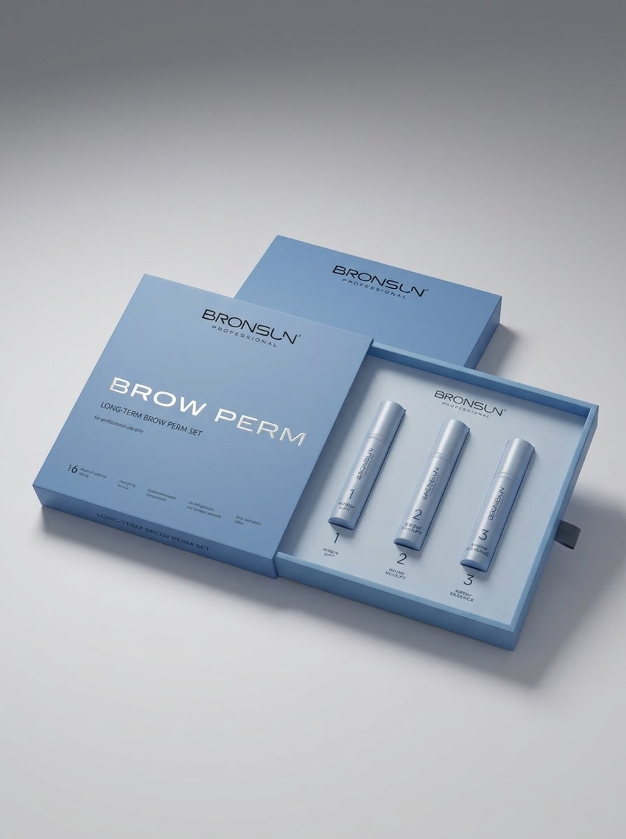 Bronsun Brow Perm long-term brow kit, featuring a light blue outer box with the brand name and product name, and an open inner tray holding three white cosmetic tubes, photographed on a clean light gray background.