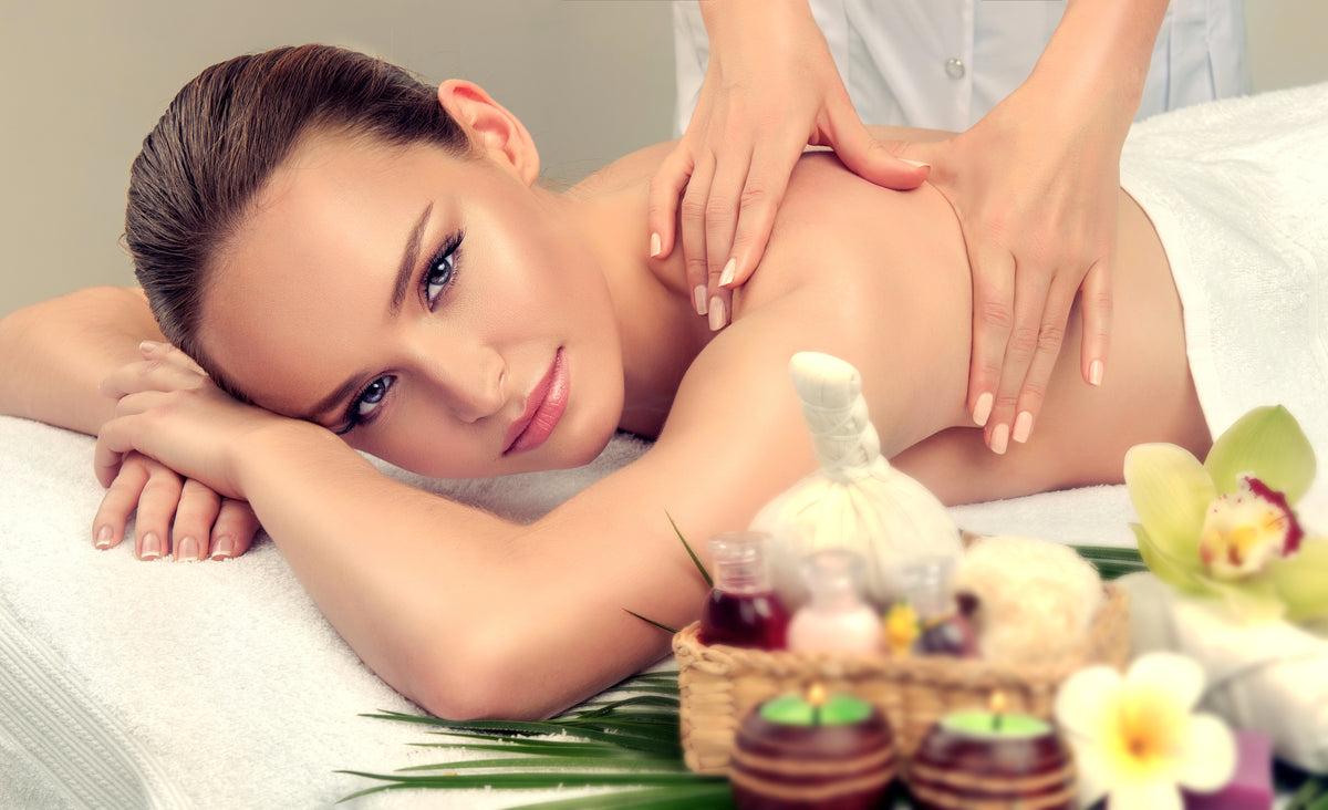 Woman having massage in the spa salon with eyelash extensions. Cartel Lash