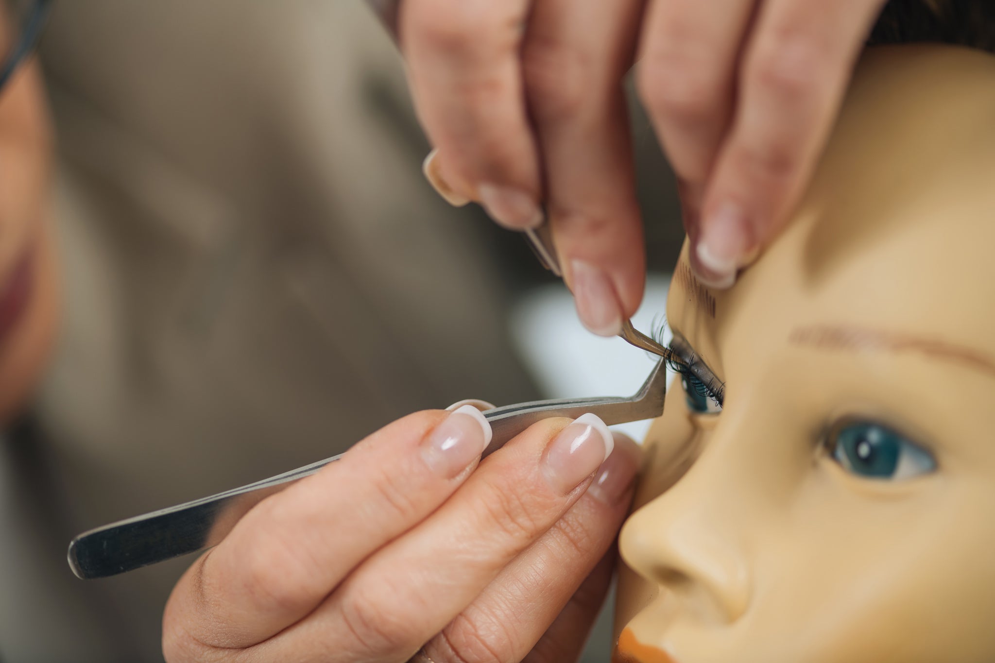 Lash tech course training on a mannequin. Cartel Lash