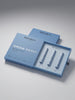 Bronsun Brow Perm long-term brow kit, featuring a light blue outer box with the brand name and product name, and an open inner tray holding three white cosmetic tubes, photographed on a clean light gray background.