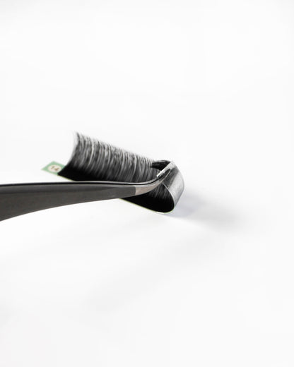 A close-up of lash extension strip, photographed on a clean white background.