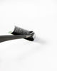 A close-up of lash extension strip, photographed on a clean white background.