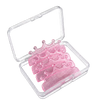 Five pink glitter crown-shaped lash lift shields arranged inside a clear plastic storage case, shown on a white background.