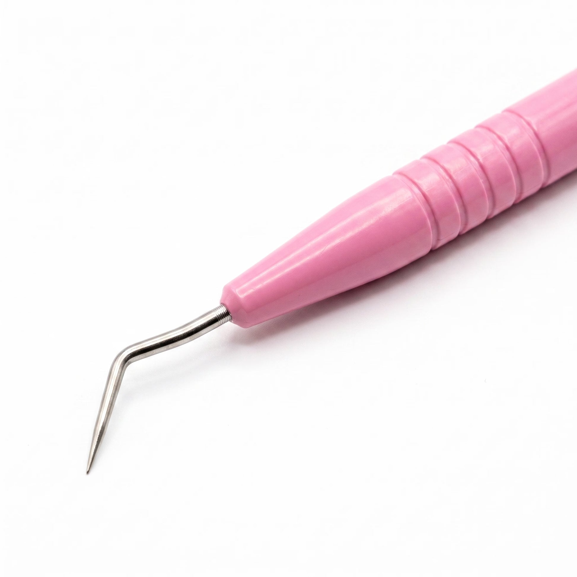A close-up of a pink-handled dental or sculpting tool with a curved stainless steel tip, shown on a plain white background.