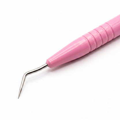 A close-up of a pink-handled dental or sculpting tool with a curved stainless steel tip, shown on a plain white background.