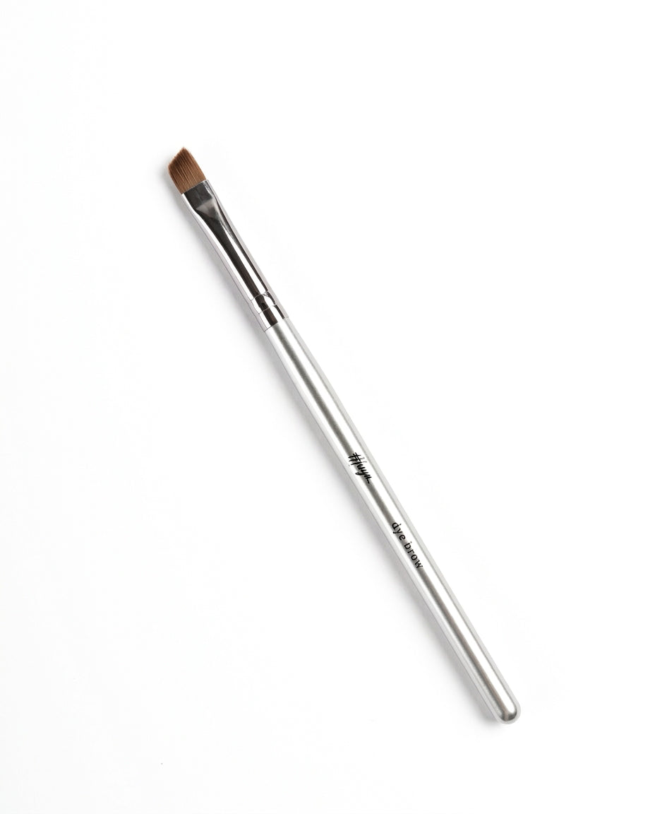 Thuya Brow Dye Brush with silver handle and angled brown bristles