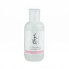 A frosted glass bottle of Thuya Professional Line Eye Make-up Remover, featuring a white label with black script and a pink accent stripe, set against a plain white background.